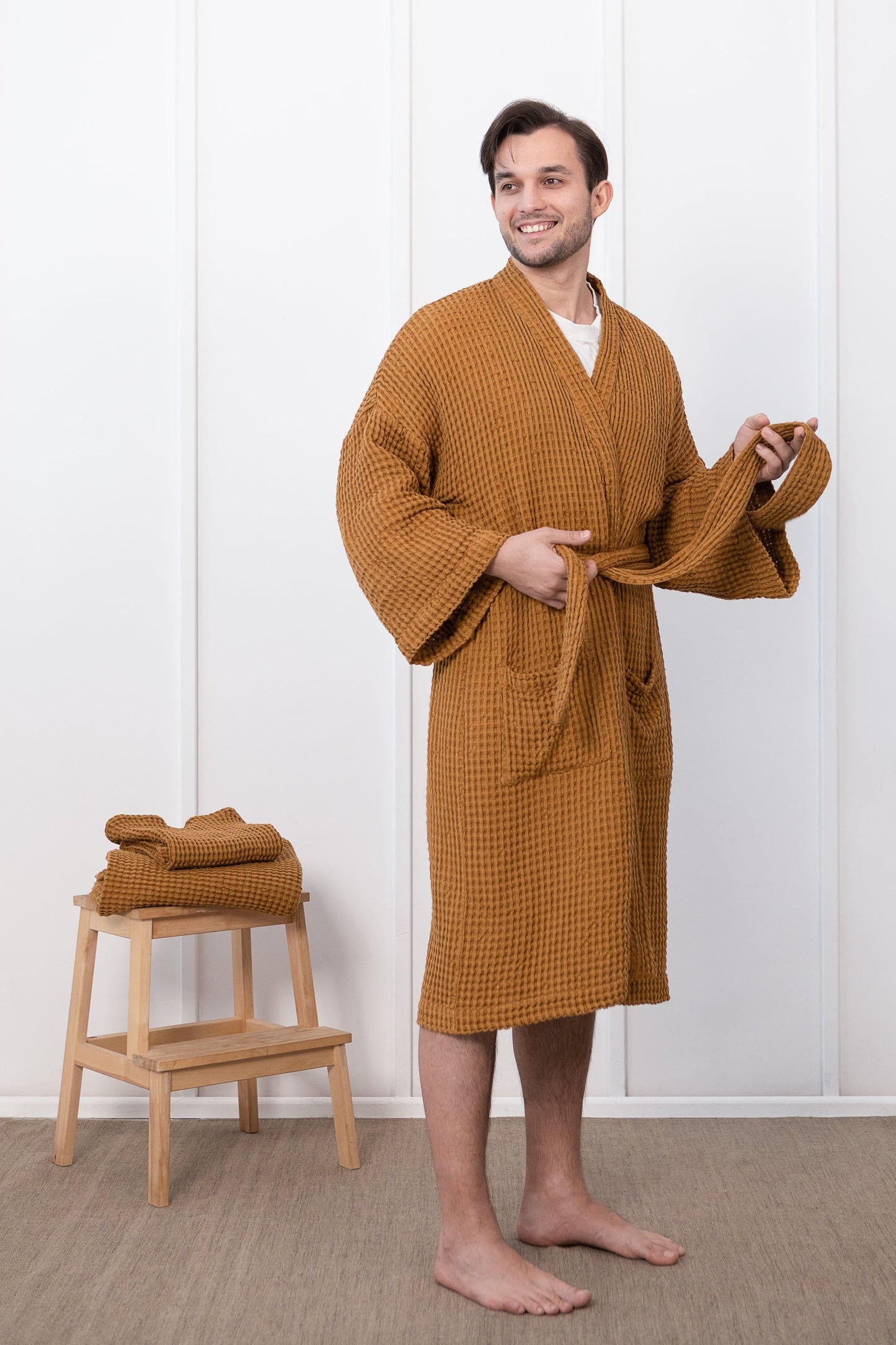 Set of linen waffle robes with towels